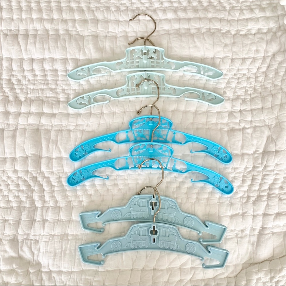 (6) Vintage 1995 blue baby clothes hangers. Circus, choo-choo & lamb motifs.RARE